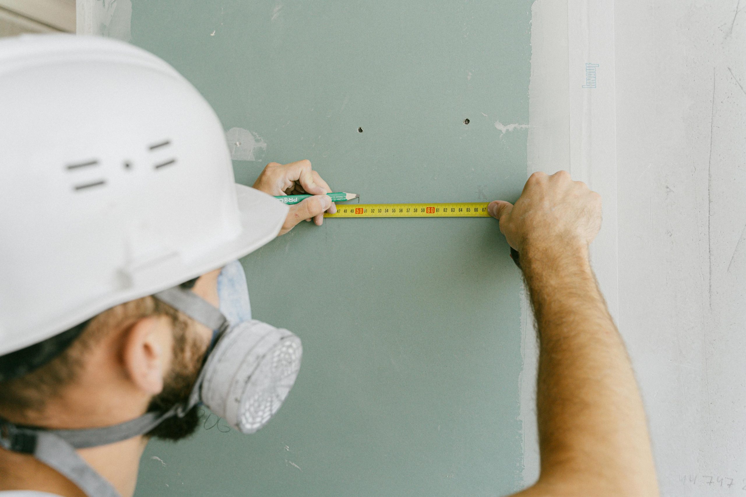 Person Holding a Tape Measure